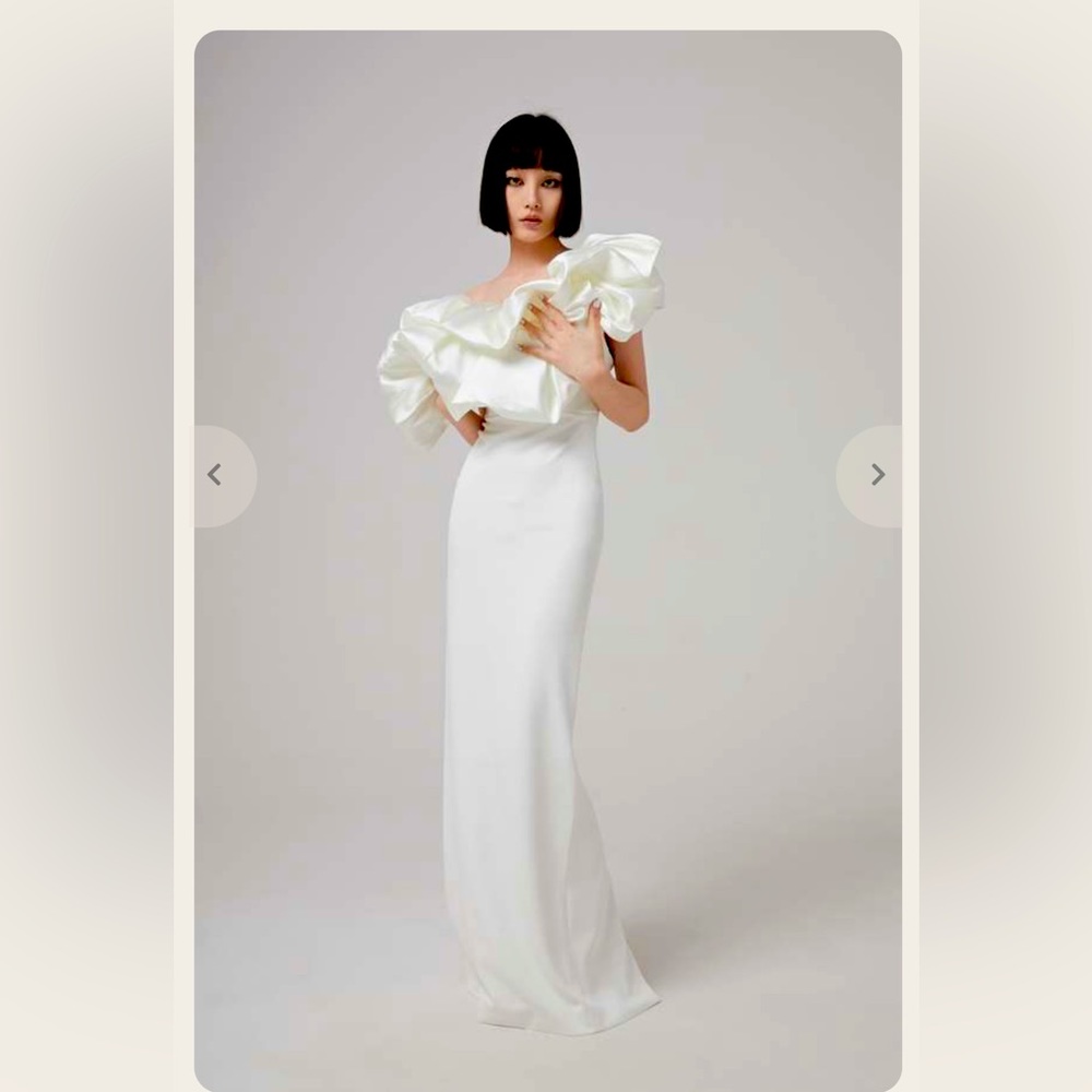 White gorgeous evening gown. New with tag. Great for wedding /rehearsal dinner.